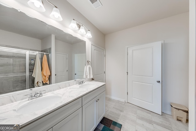 bathroom featuring vanity, tile patterned flooring, and an enclosed shower