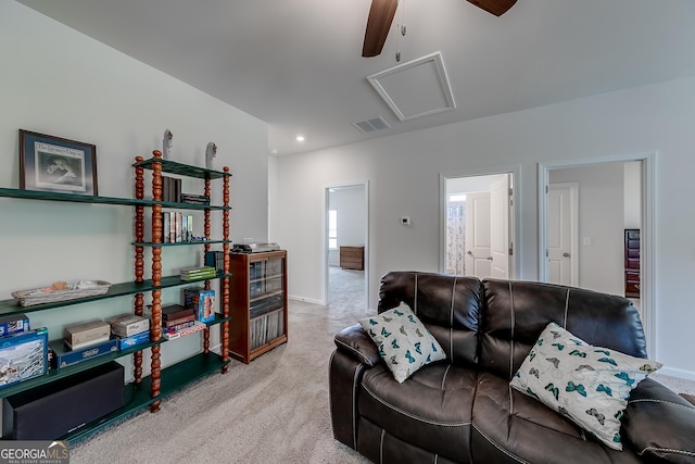 carpeted living room featuring ceiling fan