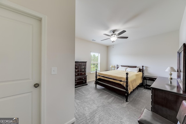 bedroom with ceiling fan and carpet floors