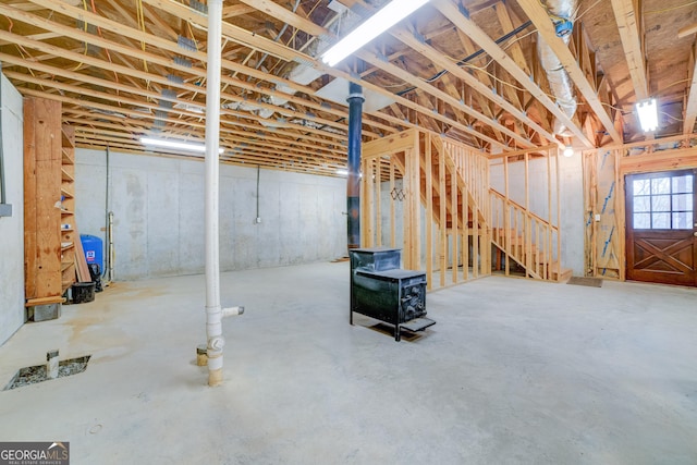 basement featuring a wood stove