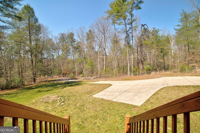 view of yard with a wooded view