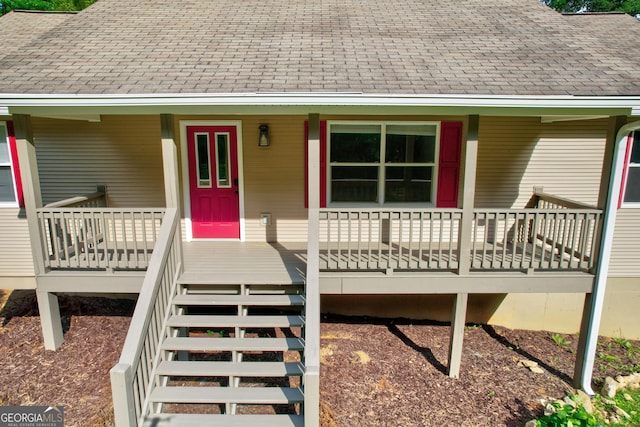 view of front of house featuring covered porch and roof with shingles