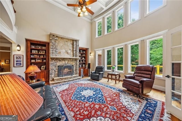 dining area featuring crown molding, coffered ceiling, hardwood / wood-style floors, and a chandelier