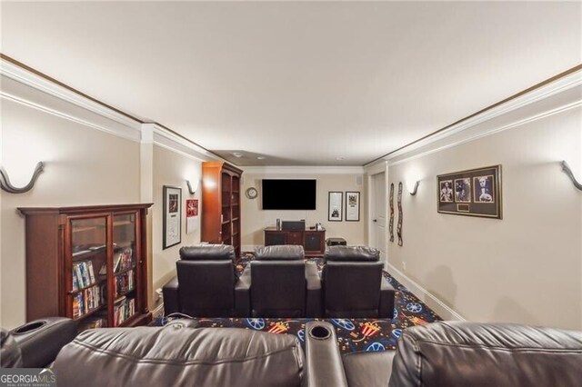 carpeted cinema featuring crown molding