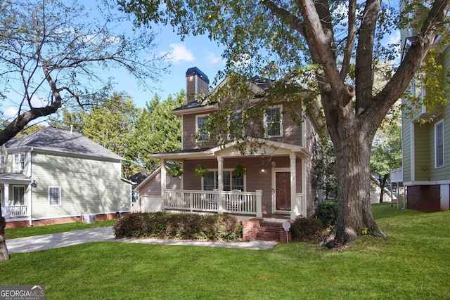 view of front of property with a porch and a front lawn