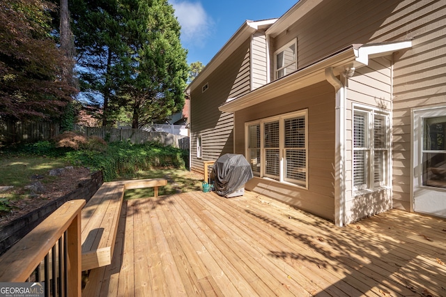 wooden terrace featuring grilling area