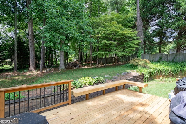 wooden deck with a yard