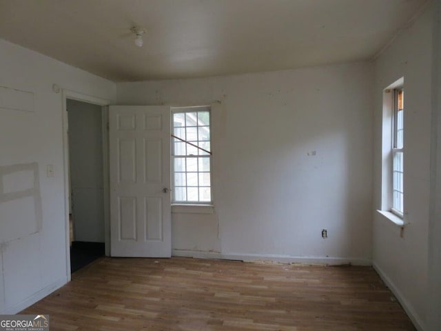 unfurnished room with light hardwood / wood-style floors