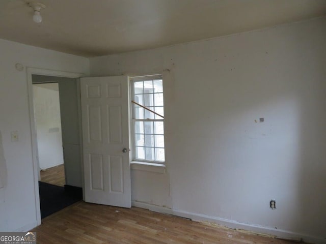 unfurnished room with light hardwood / wood-style floors