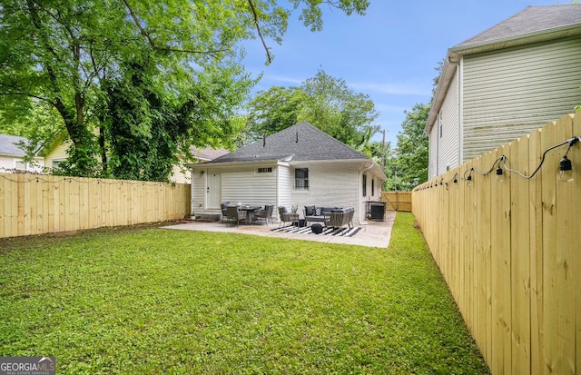 back of property with cooling unit, a yard, and a patio