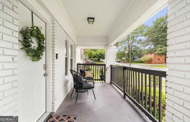 balcony featuring covered porch