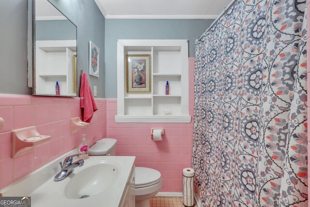 bathroom featuring crown molding, tile walls, toilet, vanity, and a shower with shower curtain