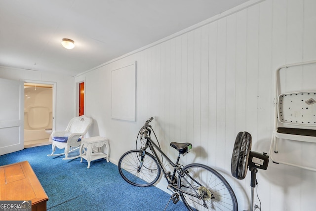 interior space with crown molding and carpet flooring