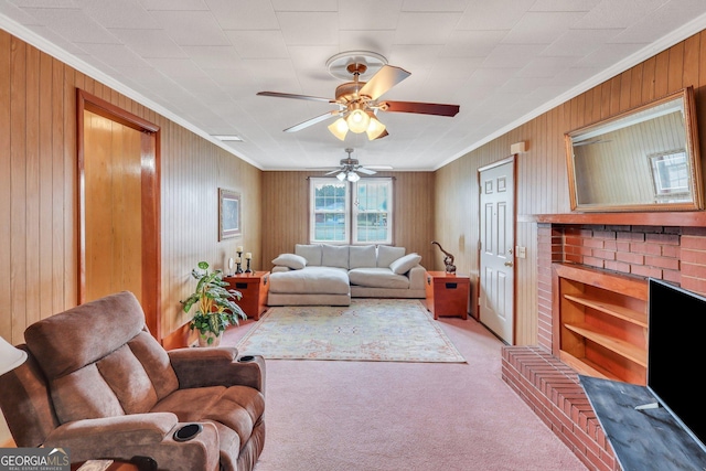 living room featuring ceiling fan, light carpet, and ornamental molding