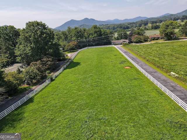 birds eye view of property with a mountain view and a rural view