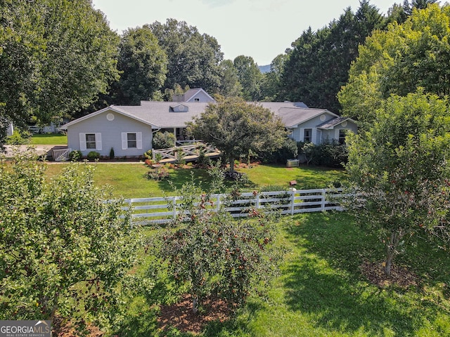 back of house featuring a lawn