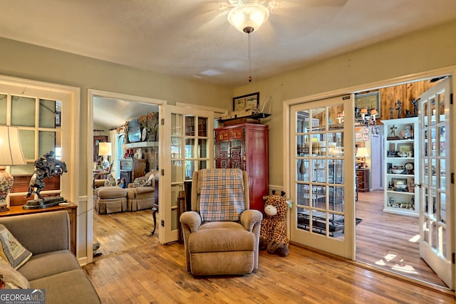 living room featuring wood-type flooring and french doors