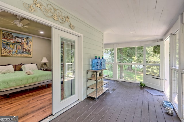 sunroom / solarium featuring a wealth of natural light and ceiling fan