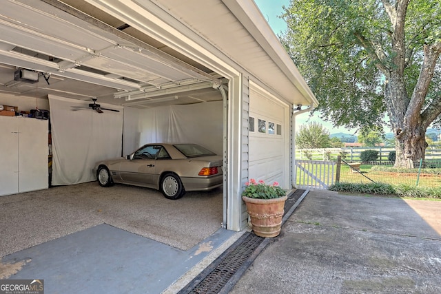 garage featuring a garage door opener and a carport