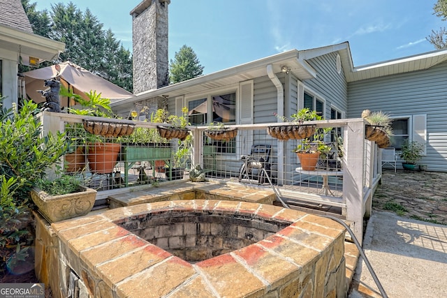 view of patio / terrace with a fire pit