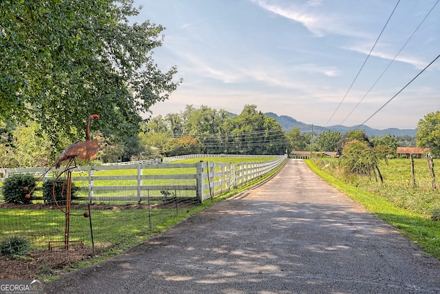 view of road with a mountain view and a rural view