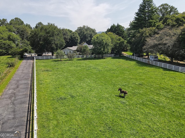 view of yard with a rural view