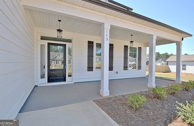 doorway to property featuring covered porch