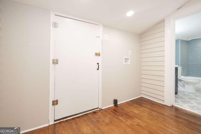 interior space with washer hookup and wood-type flooring