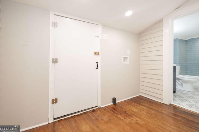 foyer featuring recessed lighting, wood finished floors, and baseboards