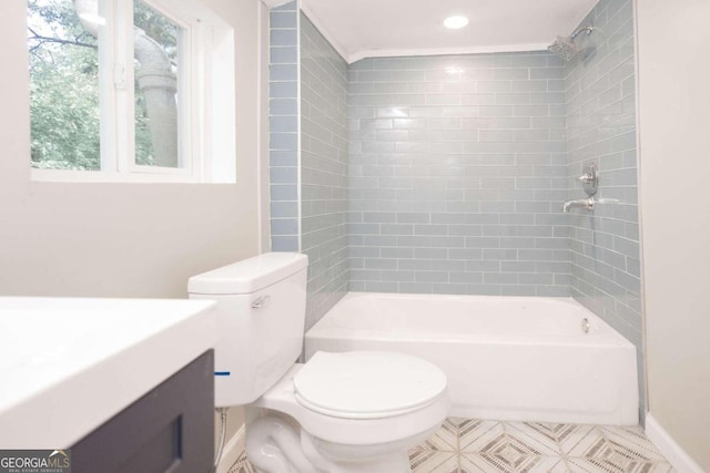full bath featuring bathtub / shower combination, baseboards, vanity, and toilet