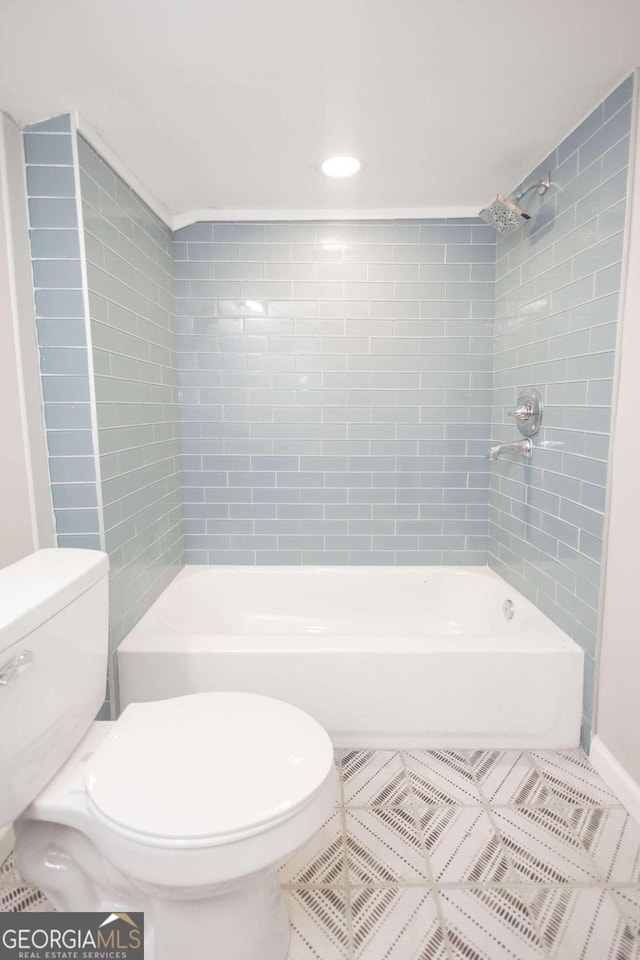 bathroom featuring toilet, tile patterned floors, shower / tub combination, and recessed lighting