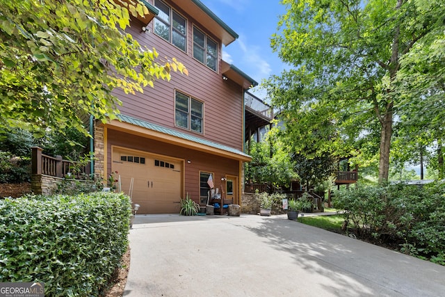 view of property exterior with a garage