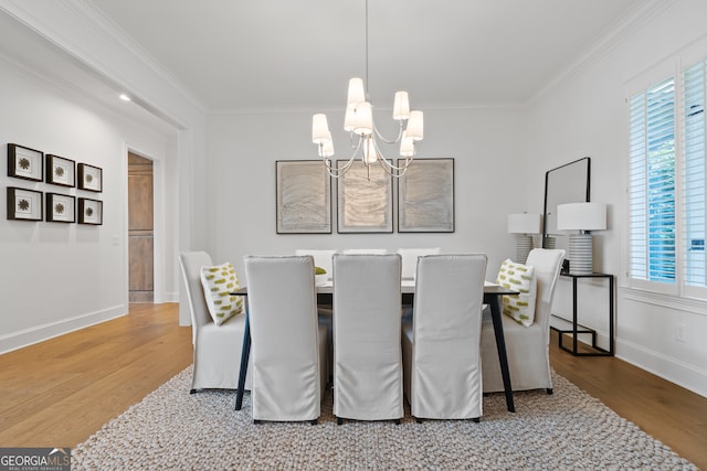 dining room with a notable chandelier, hardwood / wood-style floors, and a healthy amount of sunlight