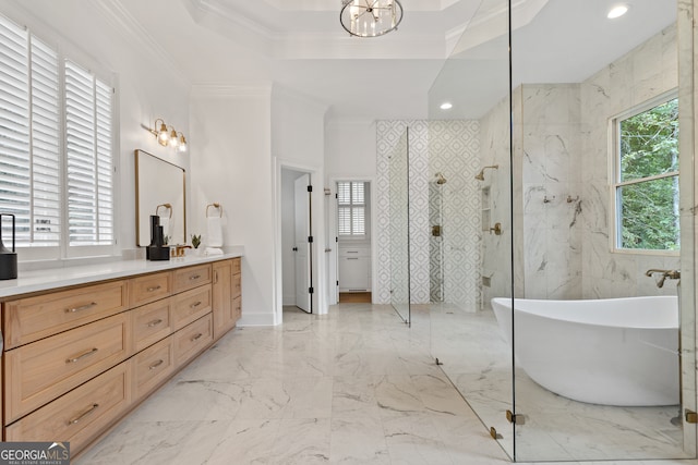 bathroom with ornamental molding, vanity, separate shower and tub, and a tray ceiling