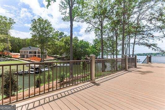 wooden deck featuring a water view