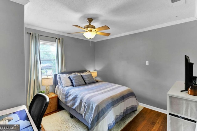 bedroom featuring dark hardwood / wood-style flooring, crown molding, and ceiling fan