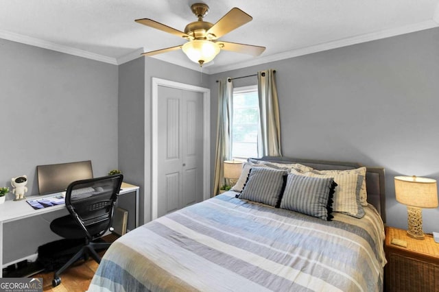 bedroom featuring crown molding, wood-type flooring, ceiling fan, and a closet