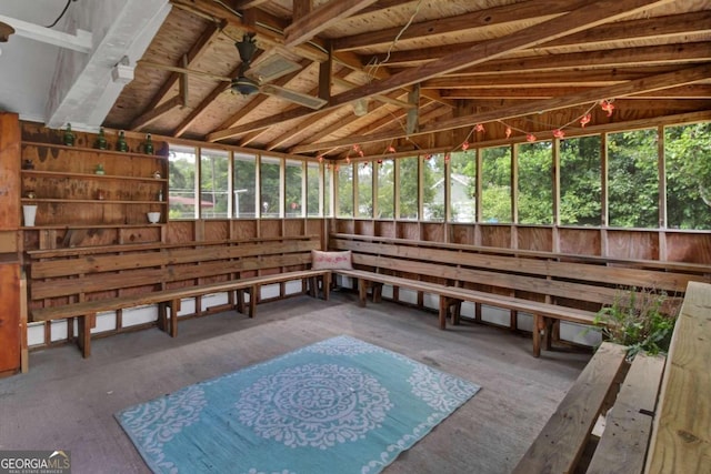 sunroom with lofted ceiling and ceiling fan