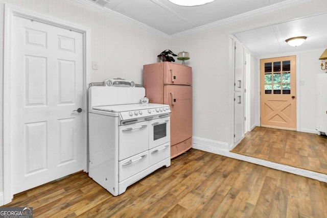 kitchen with range with two ovens, crown molding, dark wood-type flooring, and refrigerator