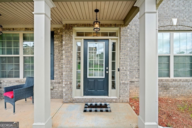 entrance to property with a porch