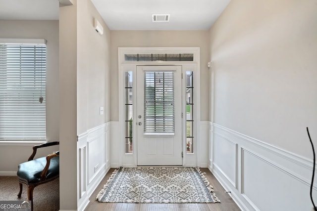 foyer with wood-type flooring