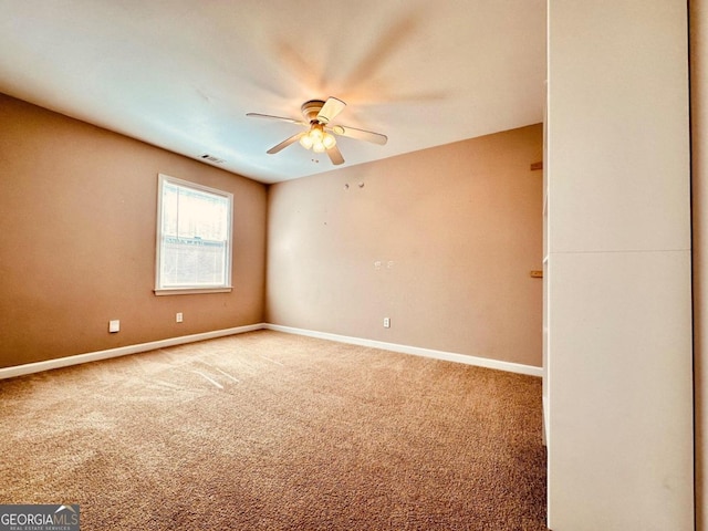 carpeted empty room with ceiling fan