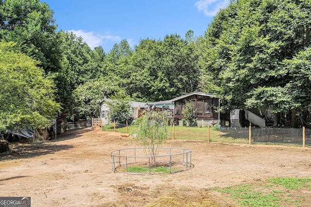 view of yard featuring a sunroom