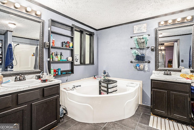 bathroom featuring a tub to relax in, ornamental molding, a textured ceiling, and vanity