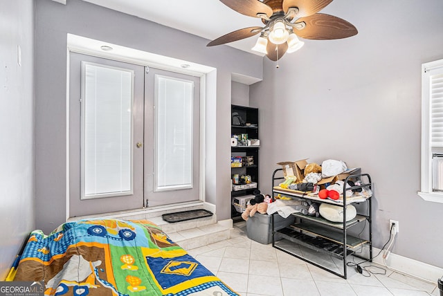 game room featuring ceiling fan and light tile patterned flooring