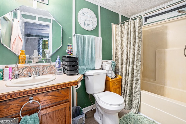 full bathroom featuring wood-type flooring, vanity, toilet, shower / bath combo, and a textured ceiling