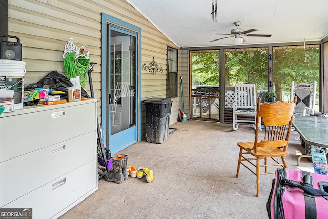 sunroom / solarium featuring lofted ceiling and ceiling fan