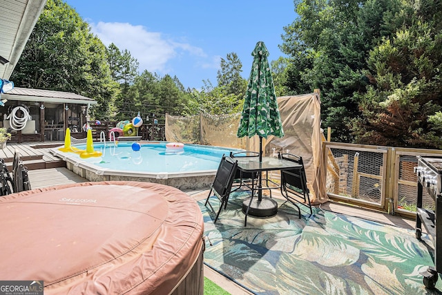 view of pool featuring a wooden deck