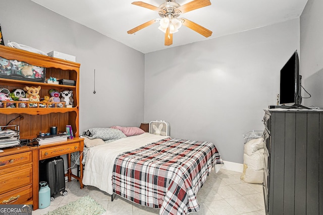 tiled bedroom with ceiling fan