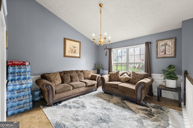 tiled living room featuring a textured ceiling, a notable chandelier, and lofted ceiling